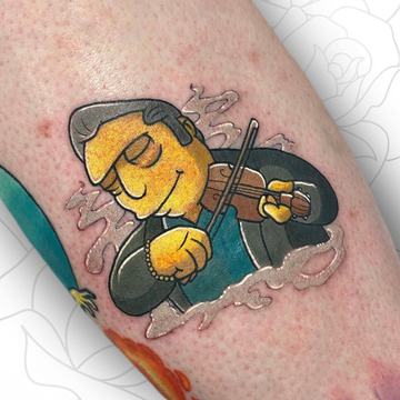 Farbiges Simpson‑Tattoo im klassischen Comic‑Stil